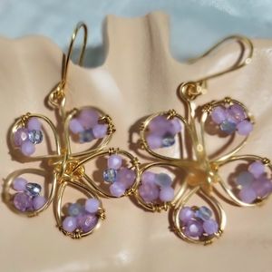 Purple beaded flower earrings.